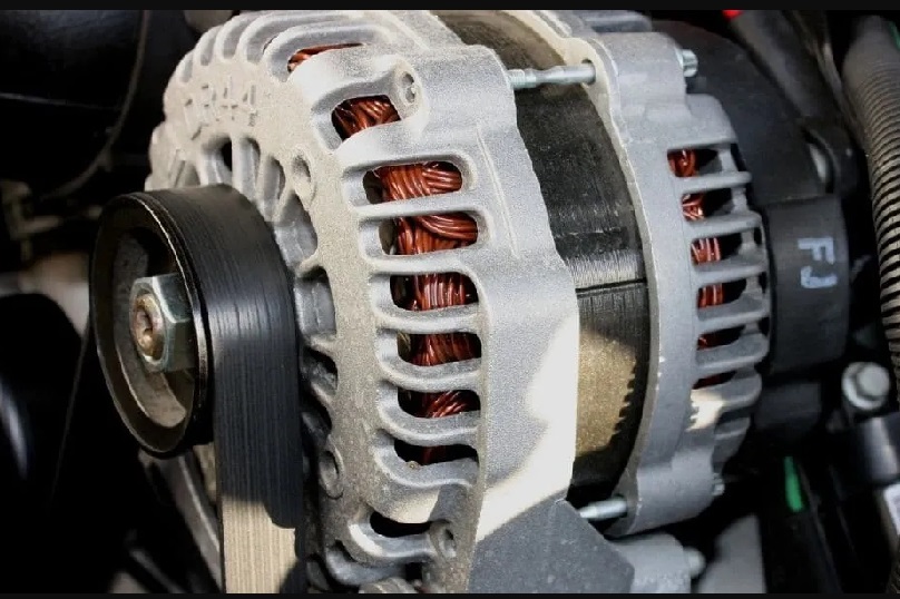 Toyota forklift alternator attached to the engine and with the belt around its pulley